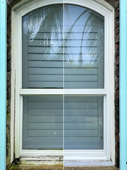 The same arched exterior window, dirty and streaked before, clear after